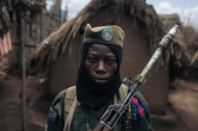 Young fighter with the FPP AP Patriotic Front for Peace Peoples Army at the group s headquarters in Mbwavinwa Lubero territory DRC. Alexis Huguet AFP Al Jazeera